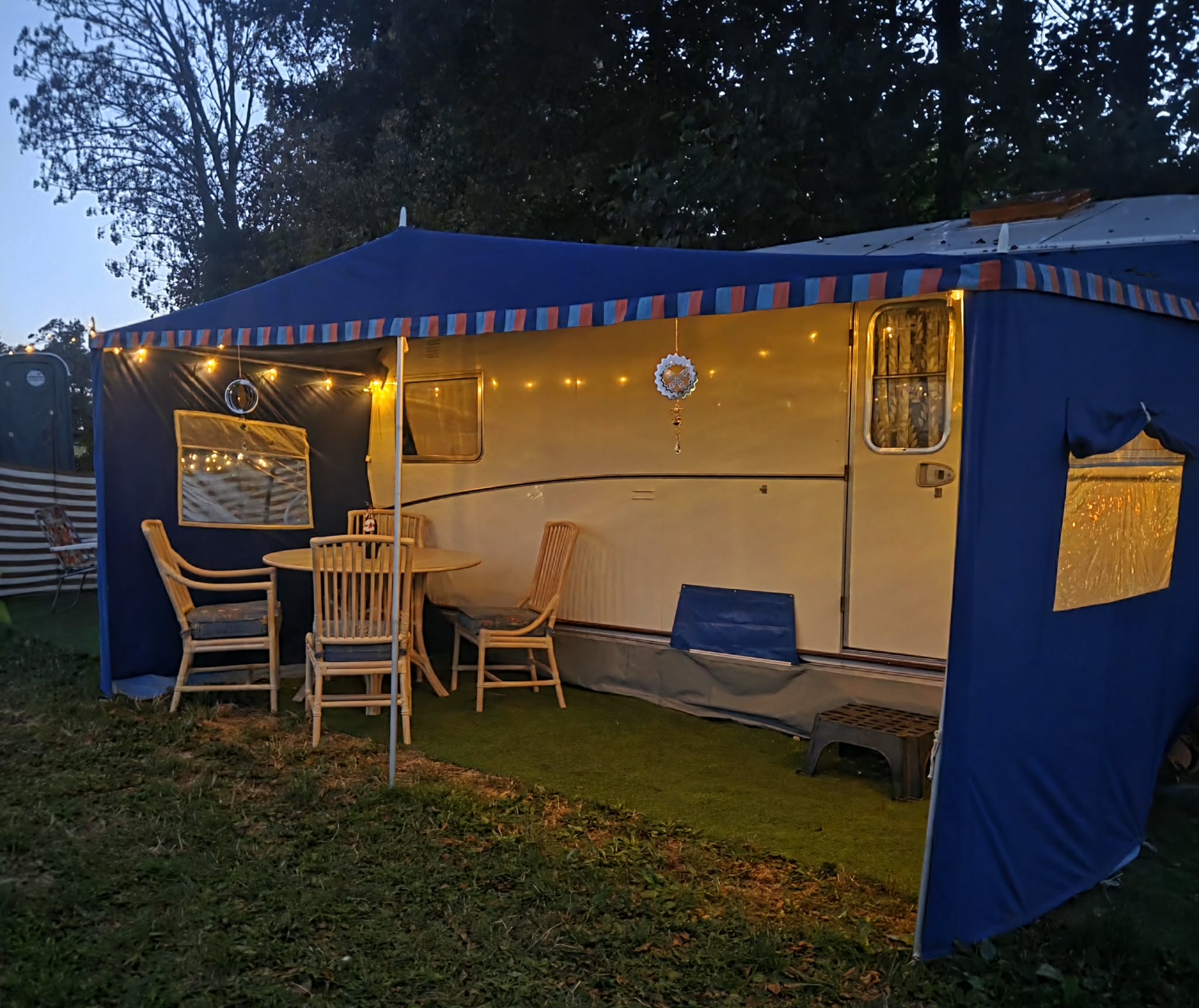 Dorothy beneath her blue awning in the evening