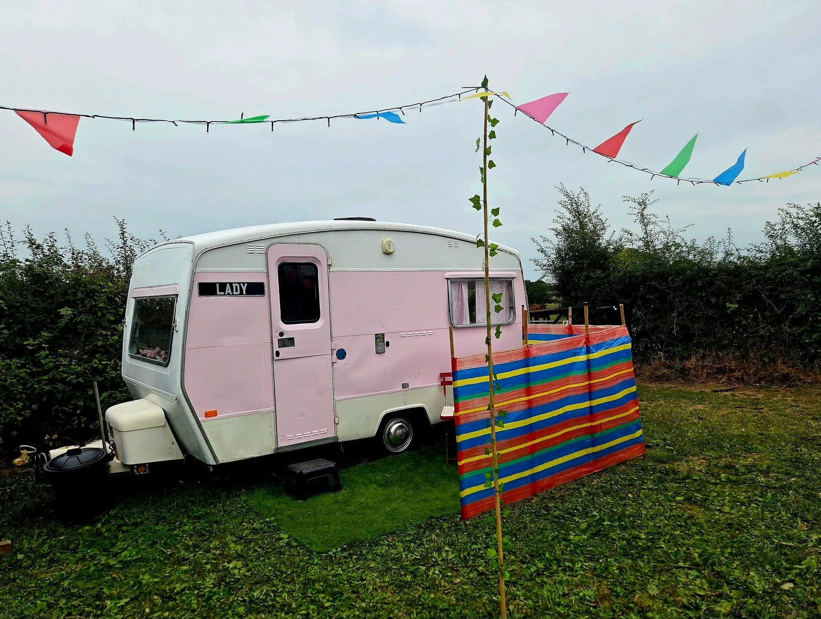 Pink Lady and her colourful outdoor seating area