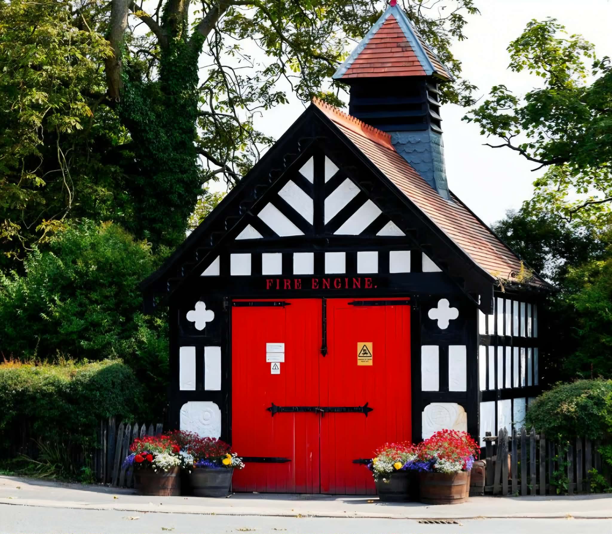 Singleton's black-and-white mock-Tudor former fire station with bright red doors