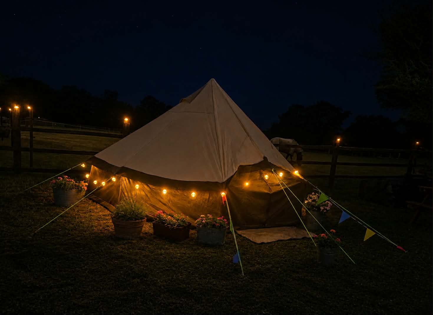 T-Pee illuminated with warm lights at night